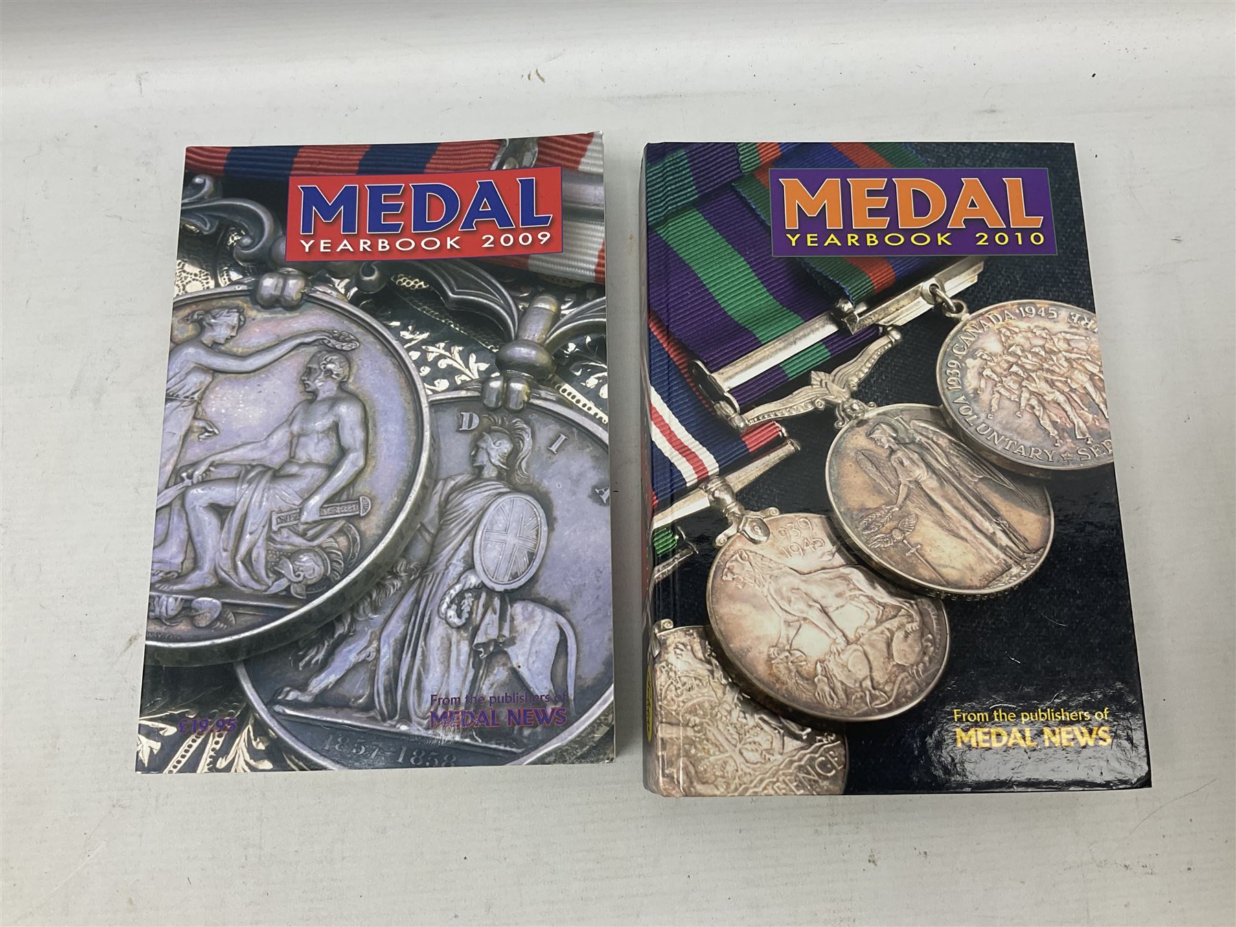 Eleven medal reference books including Ian Bisset: The George Cross; Spinks British Battles & Medals; William Spencer: Medals - The Researchers Guide; John D. Clarke: Gallantry Medals & Decorations of the World; Officers of The Green Howards 1931-1972; and six others (11)