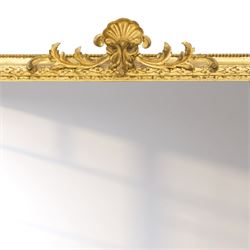 Victorian giltwood and gesso framed overmantel mirror, the scallop shell pediment with trailing acanthus leaves over a foliate moulded slip with beaded outer-edge, of rectangular arced form with floral spandrels, the base with further extending pierced scrolling acanthi decoration