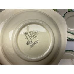 Clarice Cliff for Newport Pottery Corolla pattern tea and dinner wares, comprising triangular bowl, four side plates, two shallow bowls and teacup (a/f), together with a Clarice Cliff Wilkinson twin handled soup bowl and unassociated saucer both decorated with pink and yellow flowers, together with other mid century ceramics comprising Parrott and Company Coronet Ware, and Royal Staffordshire AJ. Wilkinson Ltd dinner wares