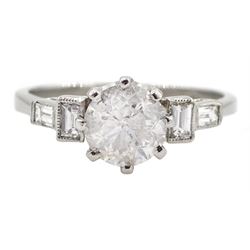 Platinum round brilliant cut diamond ring, with baguette cut stepped diamond shoulders, stamped, central diamond approx 1.05 carat, total diamond weight approx 0.30 carat