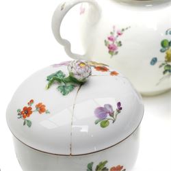 18th century Berlin part tea and coffee service circa 1780 painted with sprays of Spring flowers comprising four tea cups, five coffee cups,  six saucers, tea pot, tea caddy and sucrier and cover  