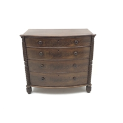  Regency figured mahogany bow front chest, four graduating drawers, turned supports, W112cm, H103cm, D57cm  