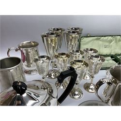 Group of metalware, largely comprising silver plate, to include oval caddy with chased decorated and ivory finial to the hinged cover, cigarette box with engine turned decoration, teapot, twin handled open sucrier, drinking glasses of various form, Elkinton Plate flatware in cylindrical boxes, various other cased and loose flatware.
