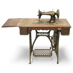 Early 20th century Singer treadle sewing machine, the black enamel machine with gilt flora...