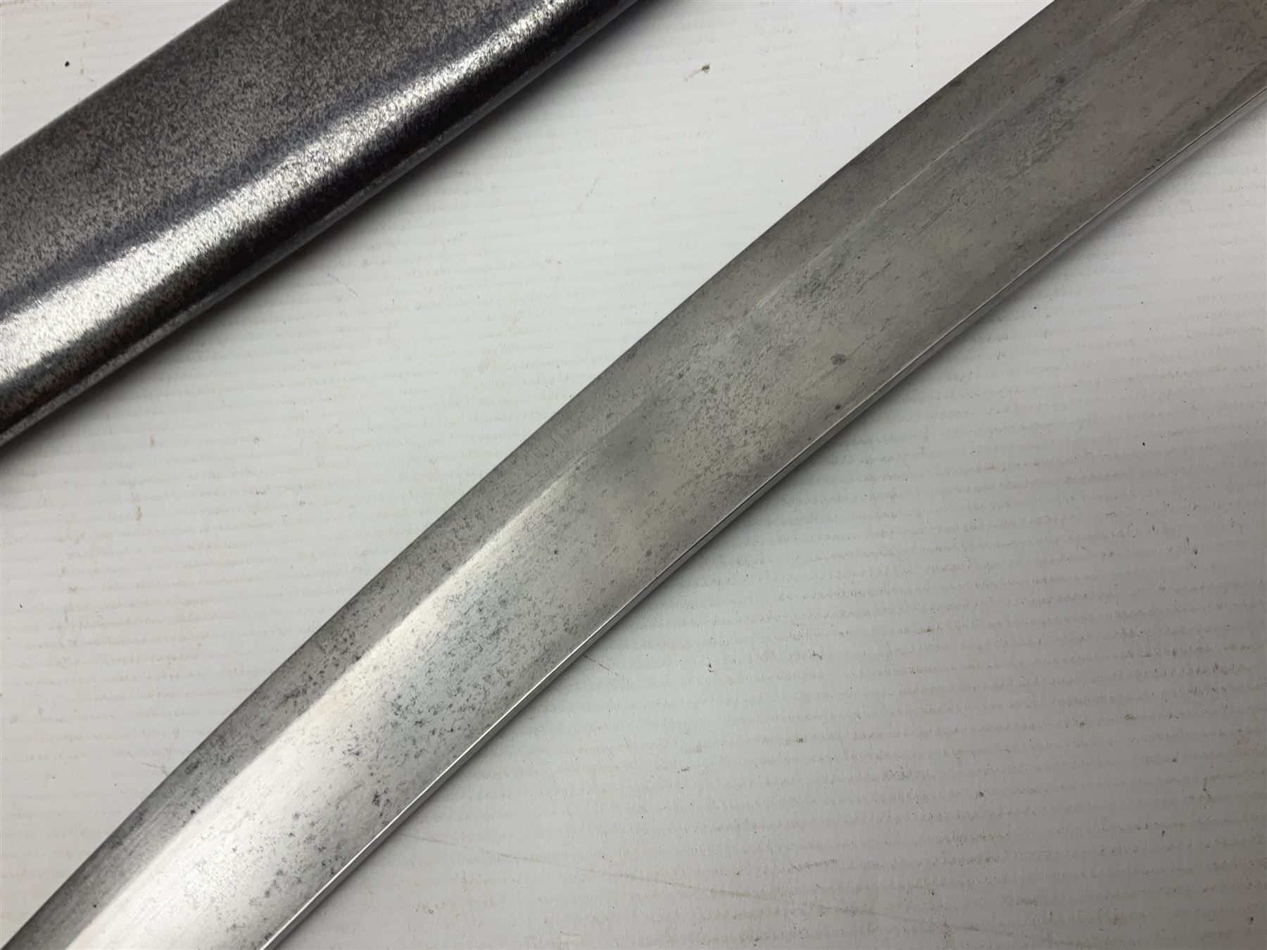 British 1796 Pattern Light Cavalry trooper's sword, the 84cm curving fullered blade stamped Hadley.1 to the back edge, steel hilt with knucklebow, D-shaped langets and leather grip; in polished steel scabbard stamped Osborn & Gunby Birmm. and W.R.16 ( ?16th Light Dragoons) with two suspension rings L100cm overall