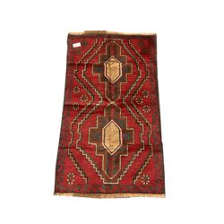 Baluchi red and blue ground rug, repeating border