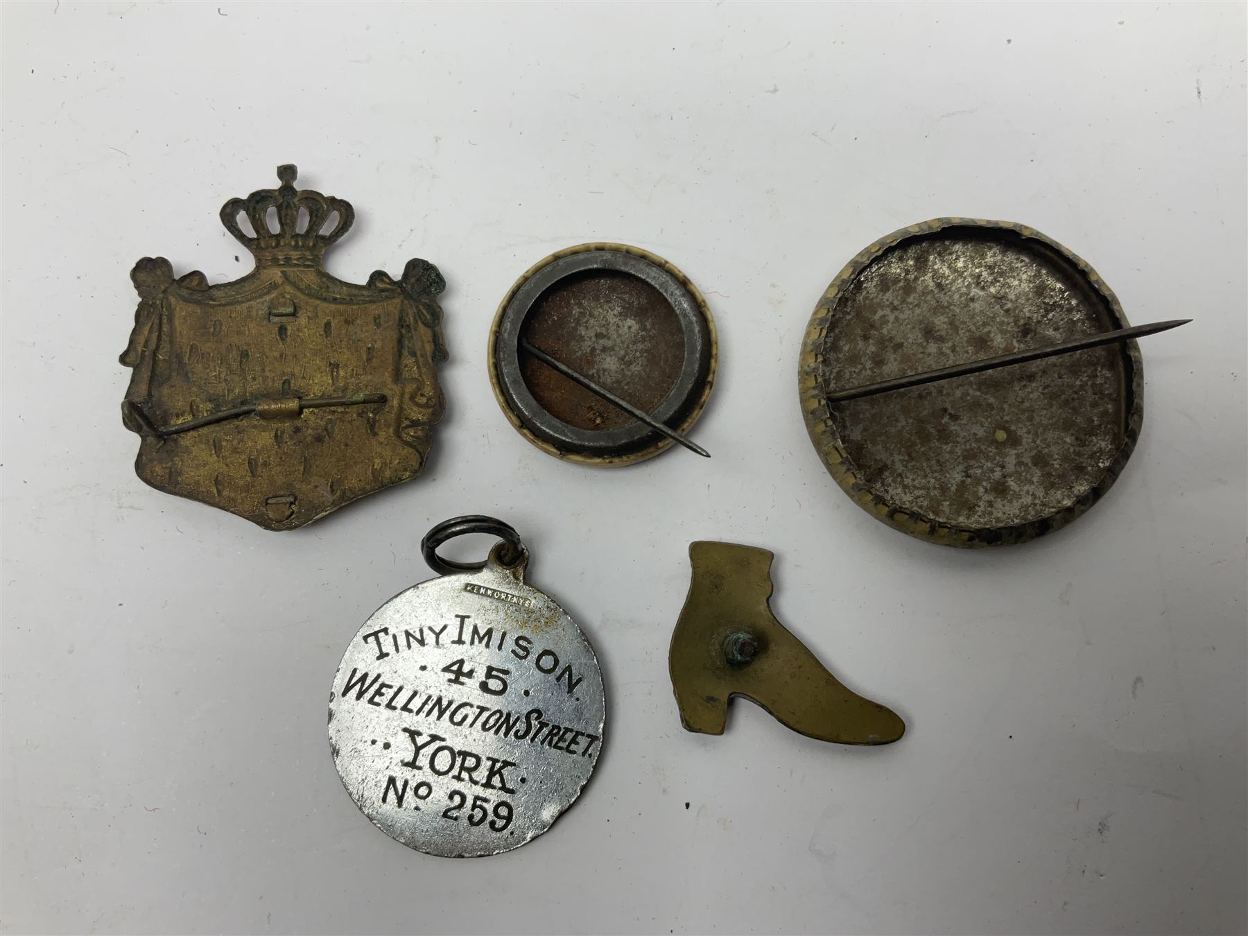 Made-up group of three WWI medals comprising 1914 Star awarded to 23598 Gnr. F. Jefferson R.G.A., British War Medal and Victory Medal with names removed; with ribbons on wearing bar; 1942 Motorist's Medal and small quantity of cap badges, Royalty badges etc