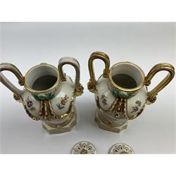 Pair of Meissen type porcelain urn shaped vases, each painted with male and female figures harvesting, pierced covers, gilt mask handles and swags, H23cm