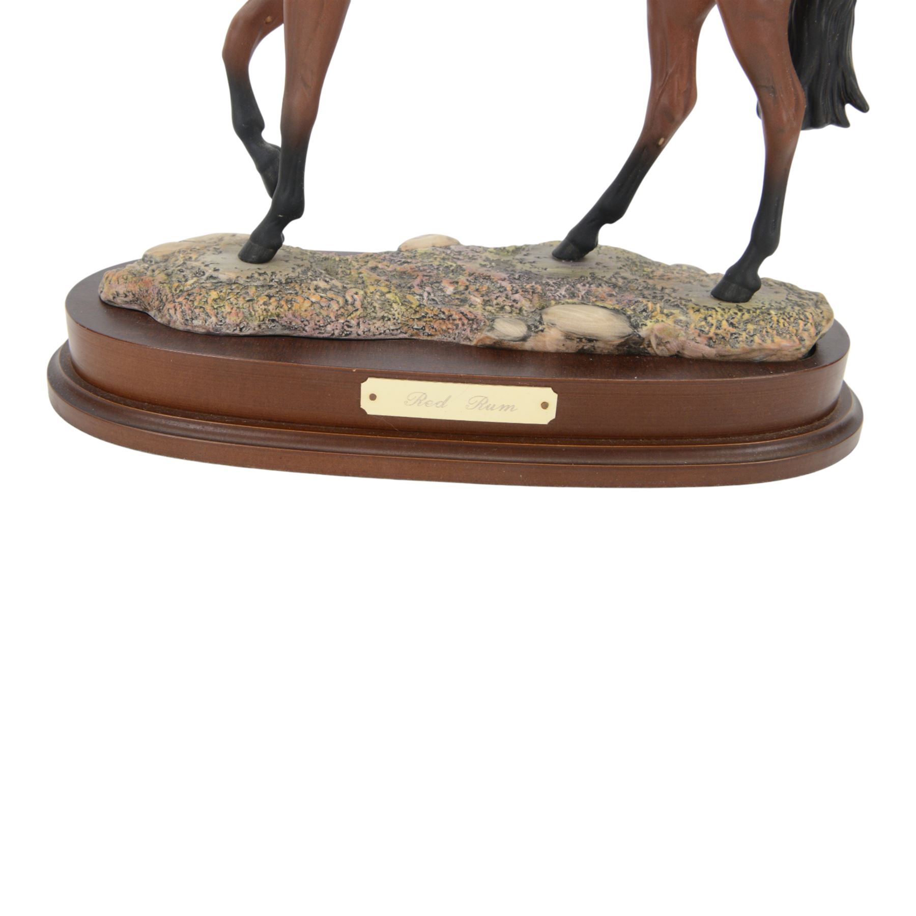Two Royal Doulton horses, Desert Orchid and Red Rum, on wooden plinths 