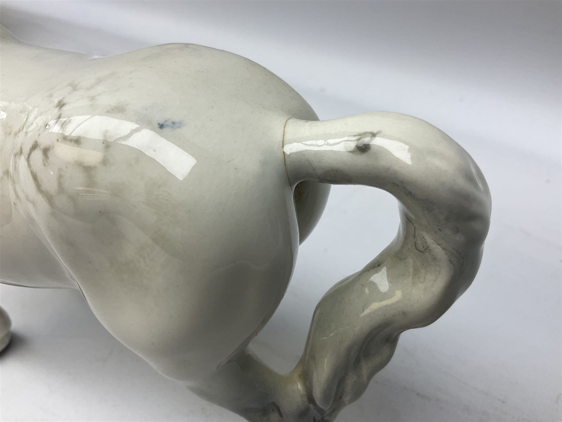 Collection of Beswick horses, including grey horse no.701, palomino foal no 836, grey stocky jogging mare no.855 etc, together two Royal Doulton horses, (8)