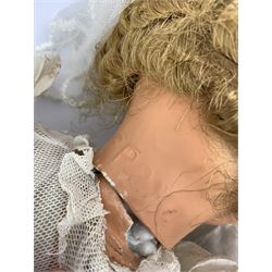 Seyfarth & Reinhardt composition head baby doll with moulded hair, sleeping flirty eyes, open mouth with one tooth and tongue and soft body with composition jointed limbs, marked 'SuR Germany 30/5' H47cm; together with a Golborne Dolls 'Golborne Beauty' composition head and body bride doll, marked 'F.P.23' in original box H63cm (2)