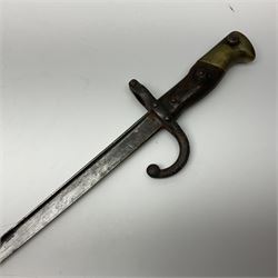 Two 19th century French model 1874 epee bayonets, each with 52cm steel blade, and armoury dates for 1880 and 1881 L64cm overall (2)