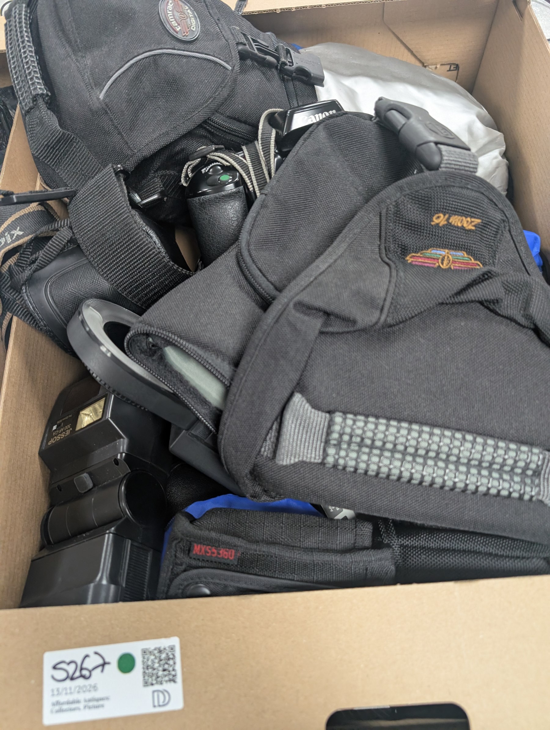 Collection of cameras and photography equipment, including Canon EOS 1000F DSLR, Fujifilm S9500, Canon EOS 10, lenses, filters, tripods, etc, in three boxes