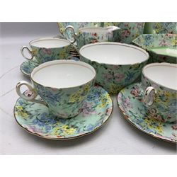 Shelley Melody pattern tea service for six, to include teapot, teapot stand, hot water jug, milk jug, covered sucrier, teacups and saucers, cake plates etc (31)