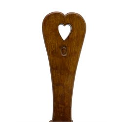Acornman - adzed oak spinning chair, spoon shaped back with pierced heart and acorn signature, spade-shaped seat raised on octagonal tapering supports by Alan Grainger of Brandsby
