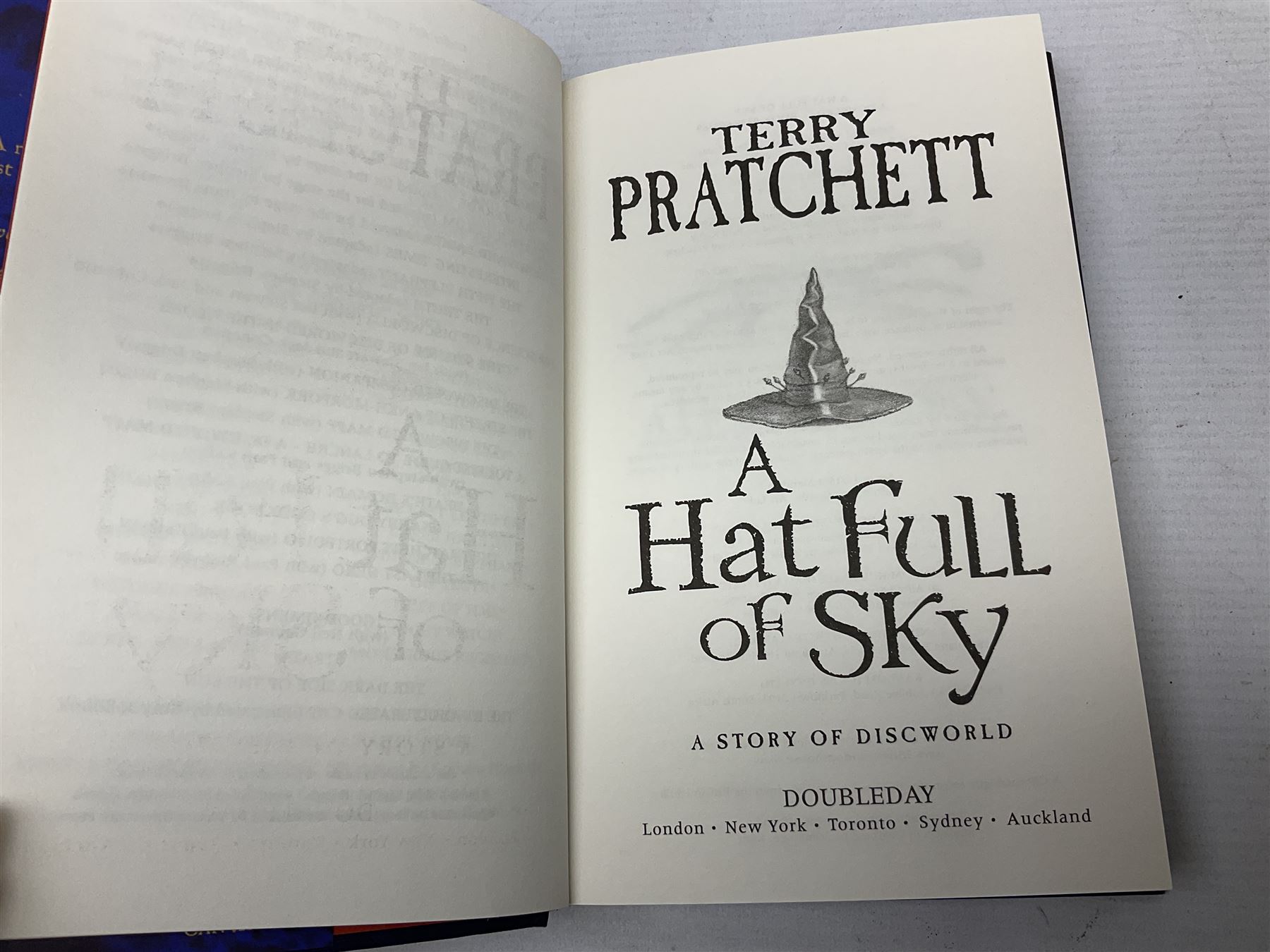 Collection of twenty-three hardback Terry Pratchett books, comprising approximately eighteen first editions including The Fifth Elephant signed & inscribed by Pratchett, all with dustjackets