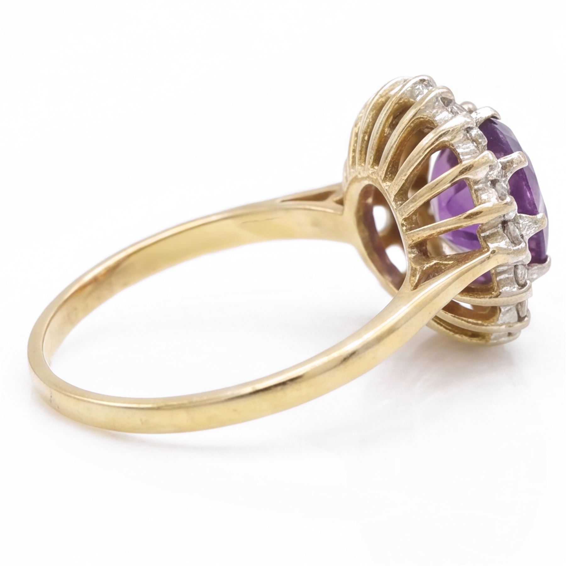 18ct gold amethyst and diamond cluster ring, single oval cut amethyst surrounded by sixteen single cut diamonds, London 1967