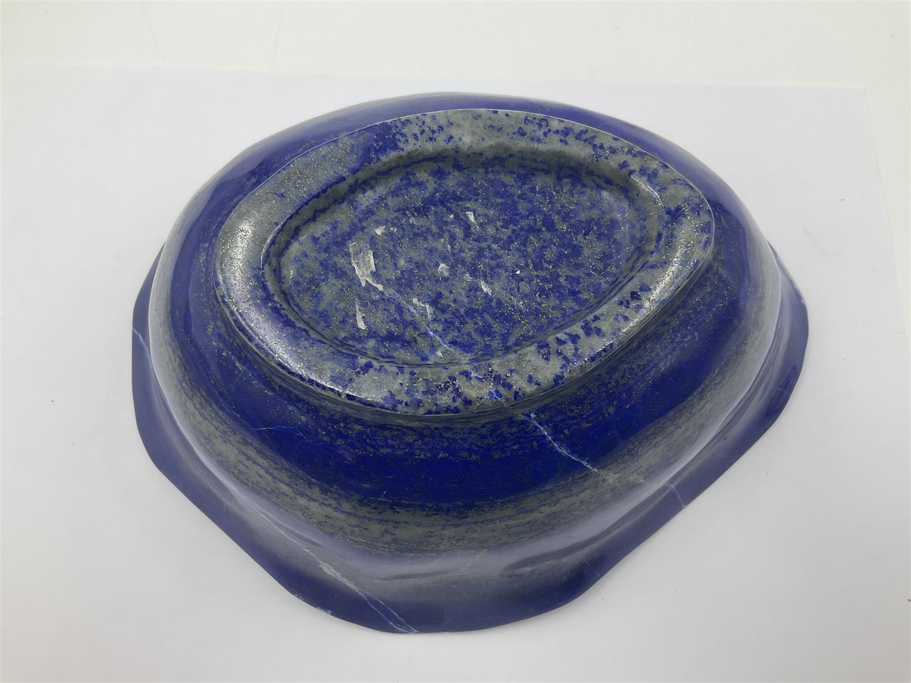 Carved bowl, flat-bottomed bowl carved from a single piece of Lapis lazuli with flared rim, H8cm, L21cm