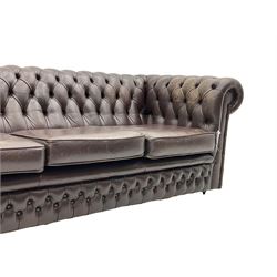 Chesterfield style three seat sofa, upholstered in buttoned burgundy leather