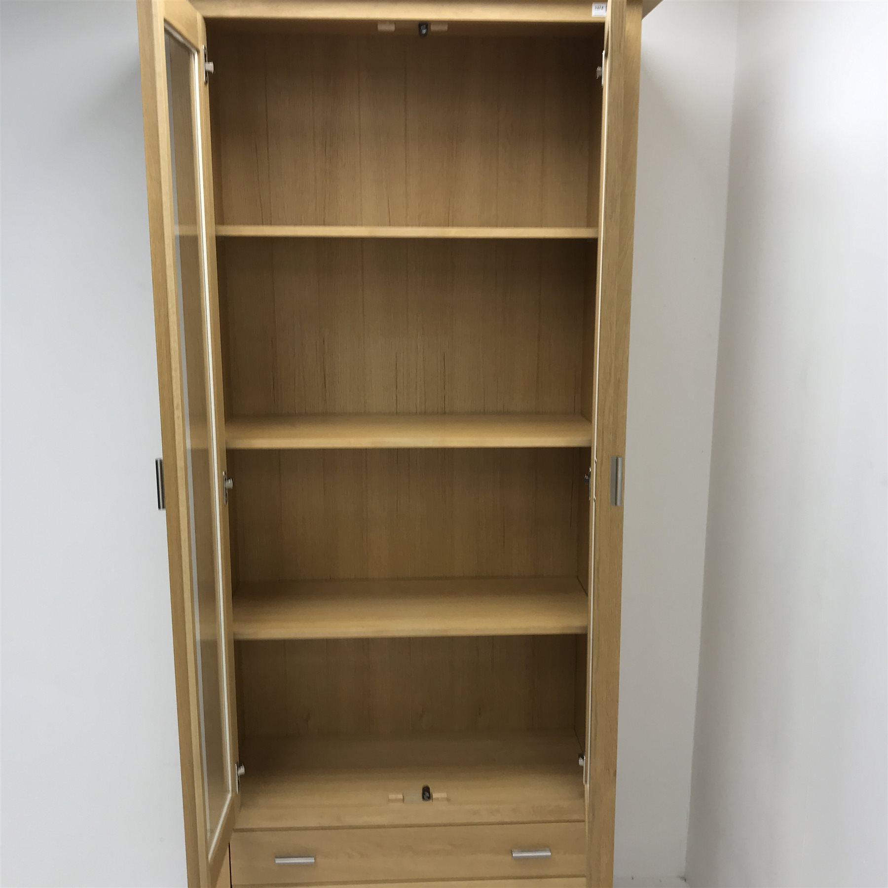 GPlan oak display two glazed doors enclosing two shelves above two drawers, stile