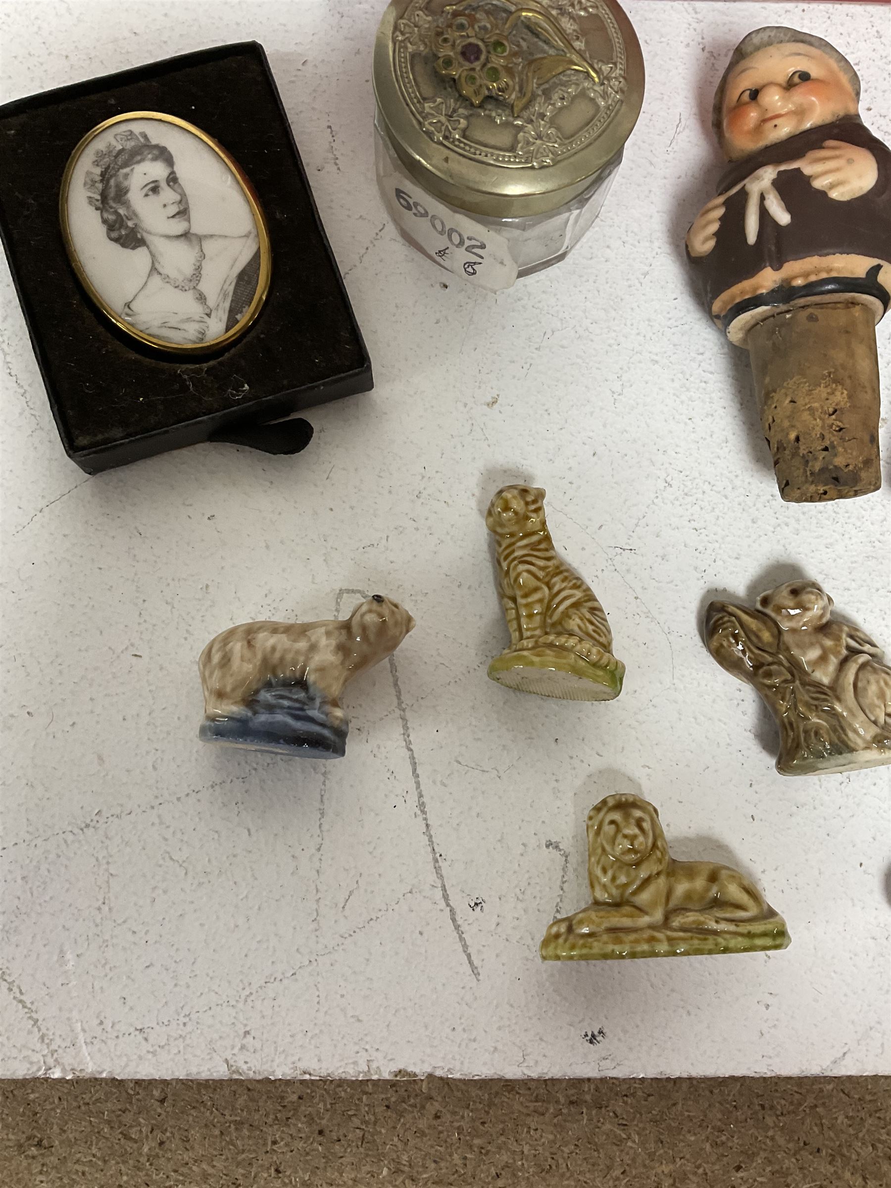 Seven Wade Whimsies, leather falcon hood, three novelty bottle corks, pair of EPNS open salts and other collectables