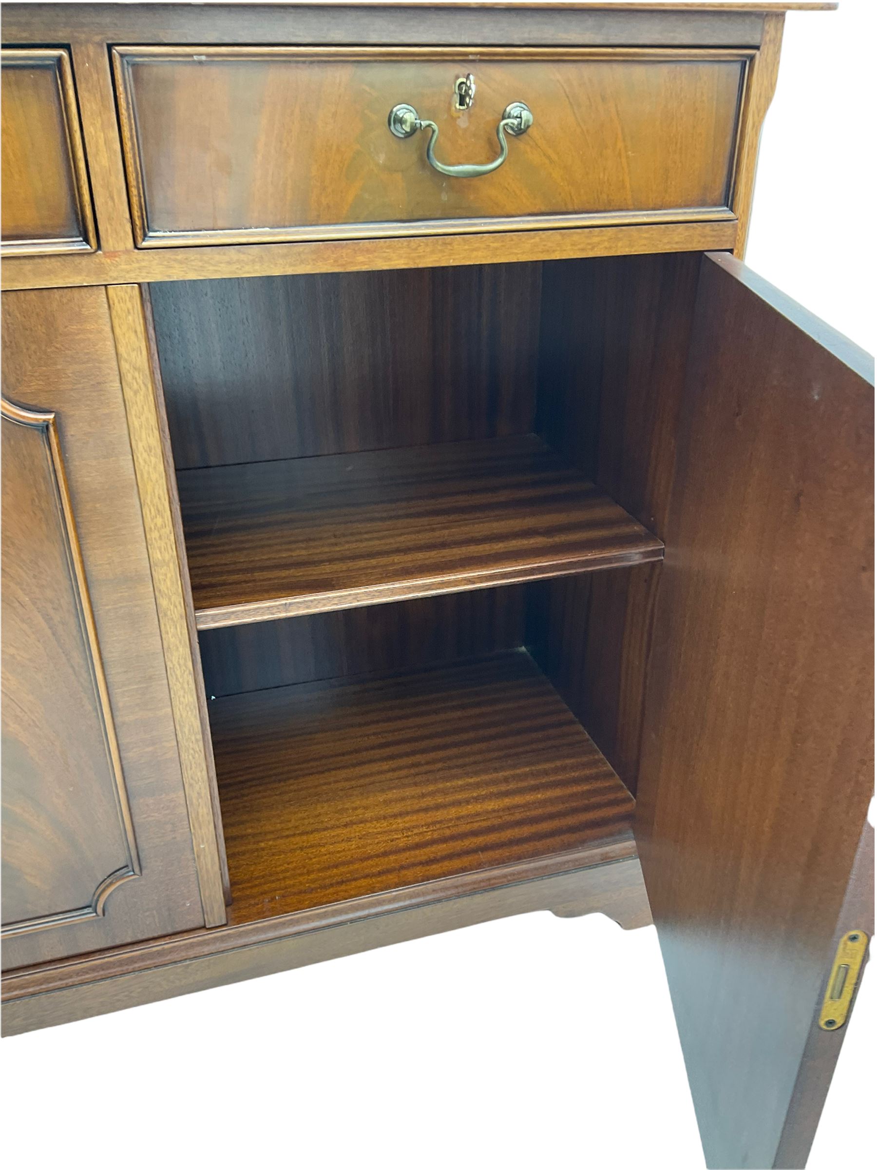 Reproduction mahogany side cabinet, moulded rectangular top over two drawers and double cupboard, bracket feet