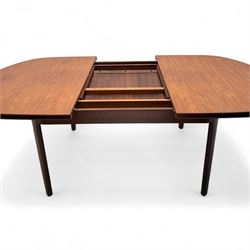 G-Plan - mid-20th century teak oval dining table, with butterfly leaf extension mechanism and four Elliot's of Newbury teak framed dining chairs upholstered in purple and green fabric, table un-extended width 152cm x depth 152cm x height 71cm, chairs 47x37x78cm 