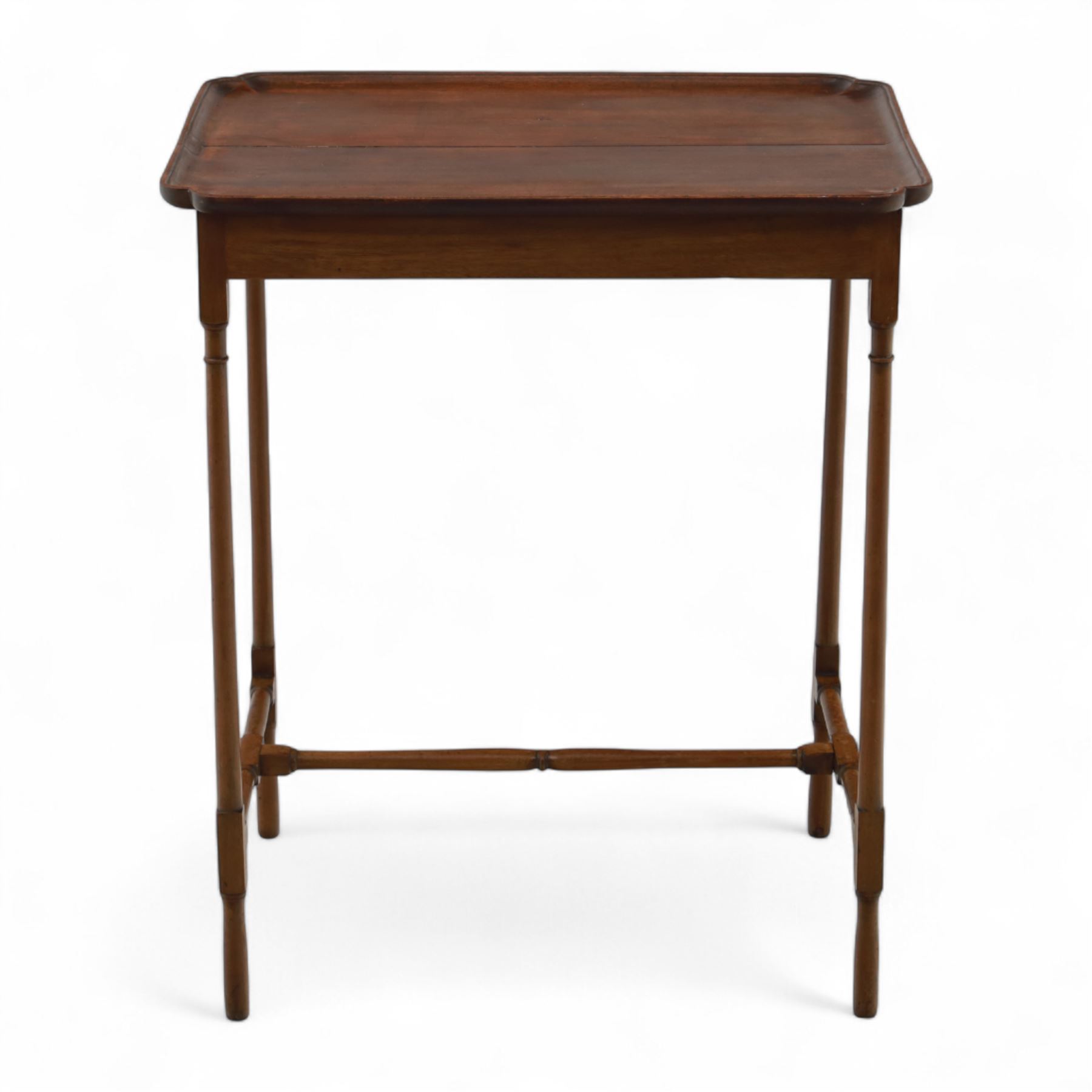 Early 20th century mahogany butler’s tray table, rectangular dished top with shaped corners, raised on turned faux bamboo legs with stretchers