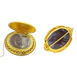 Victorian gold hinged locket brooch, the monogrammed black enamel front revealing hairwork glazed locket and an Victorian 18ct gold Etruscan design brooch