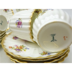  Set of nine early 20th century Bishop & Stonier trios, of ribbed form, decorated with floral sprays and gilded rim, comprising 11 saucers, 9 tea cups and 10 plates   