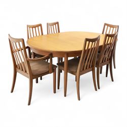 G Plan - mid-20th century teak extending dining table, oval top with integrated extension leaf, raised on tapering legs, together with a set of six slat back dining chairs including two carvers, upholstered in dark green velour (Extends to 210cm)