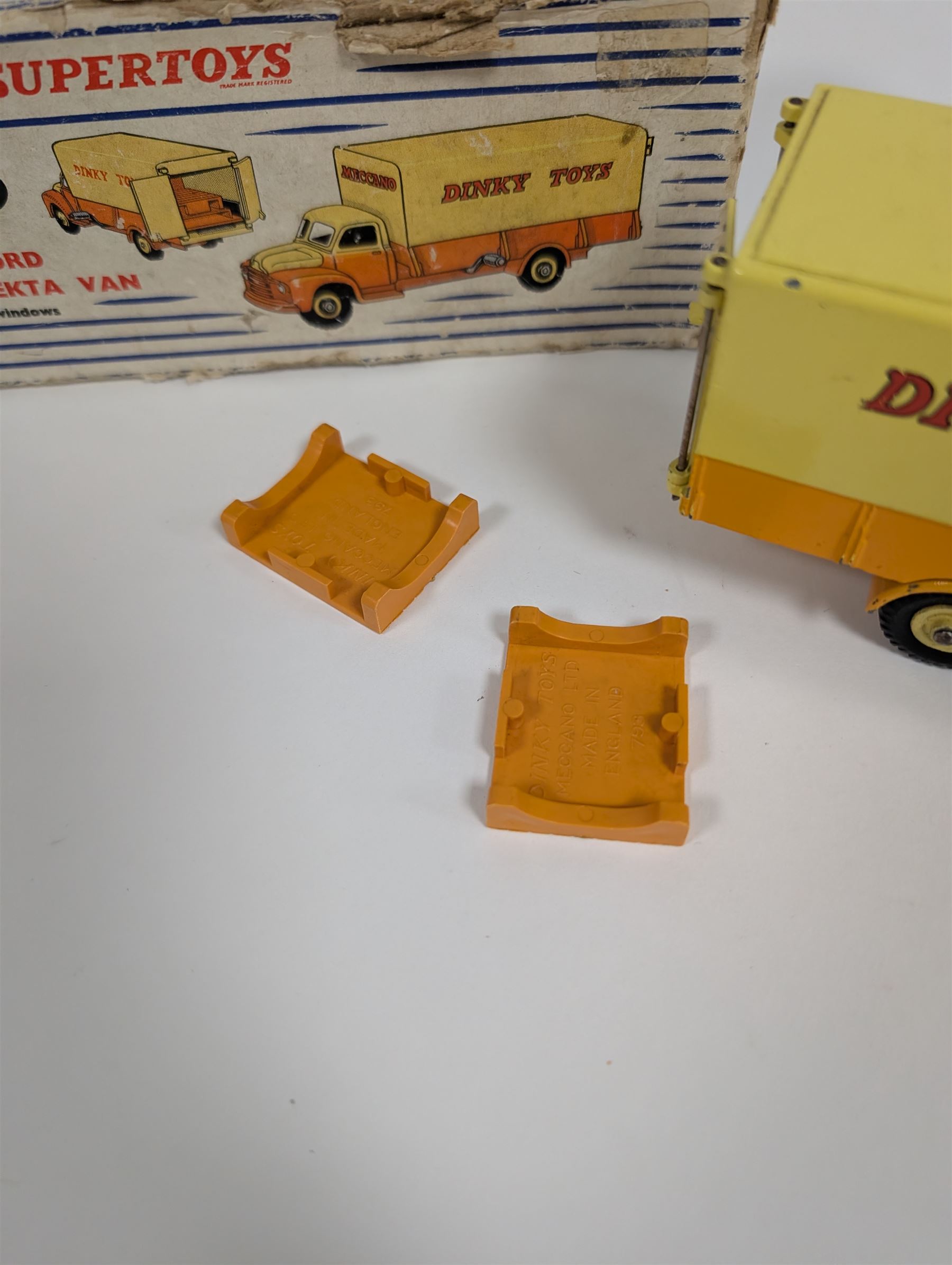Dinky Toys Bedford Pallet Jekta Van no 930, two tone yellow body with red 'Dinky Toys' lettering, in original box with two orange pallets and instructions