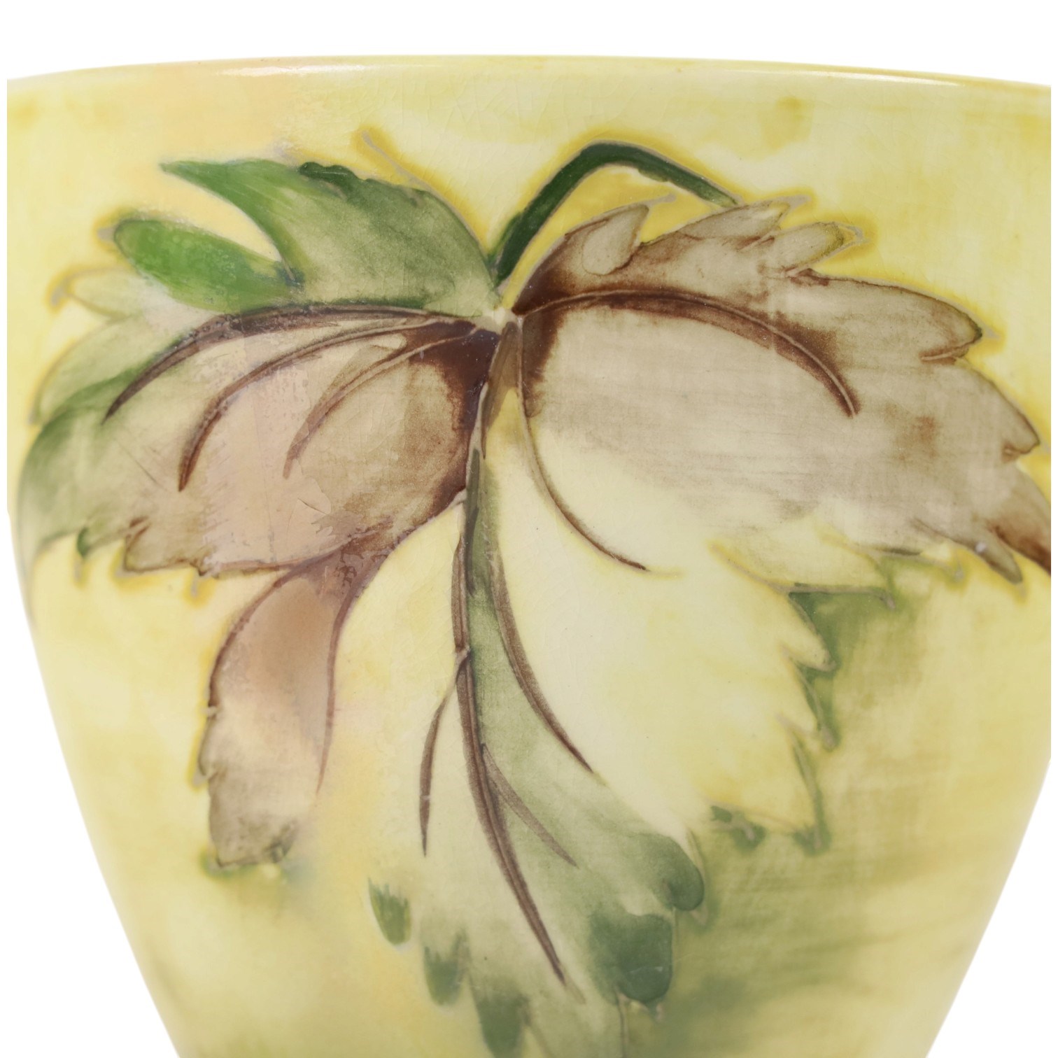 Moorcroft bowl, Leaf in the Wind pattern, upon a yellow grounds, with painted mark and sticker beneath, H12cm