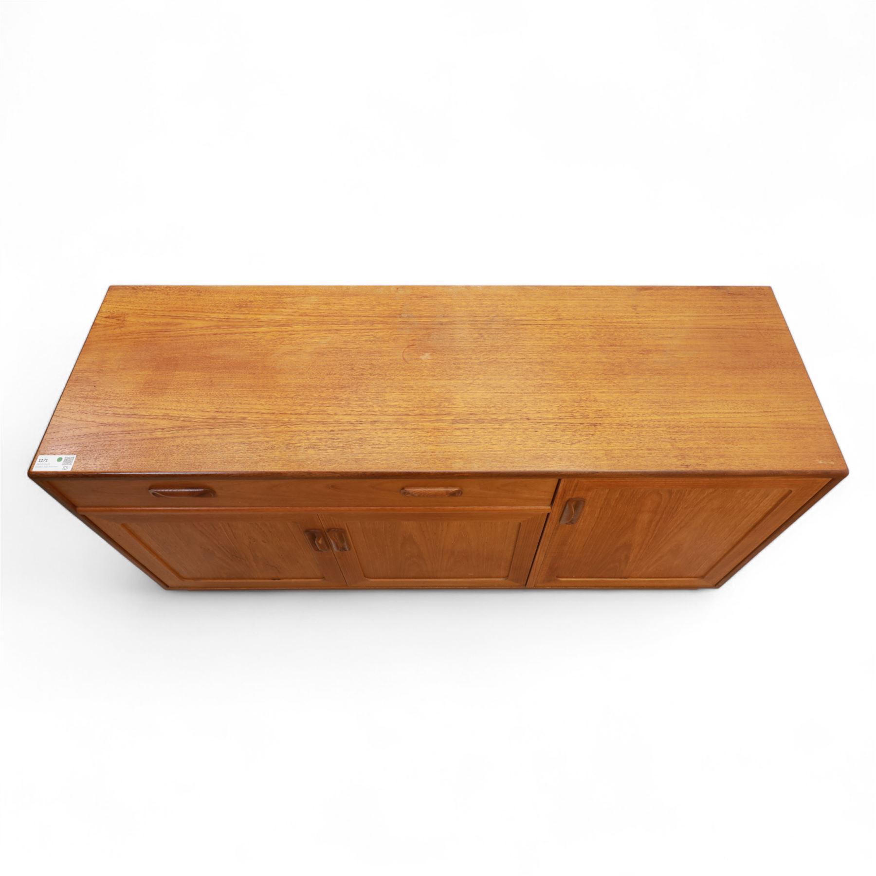G Plan - Mid-20th century teak sideboard, fitted with single drawer above three cupboard doors, recessed handles throughout, raised on a plinth base