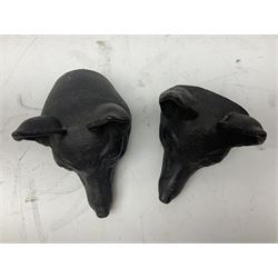 Two cast iron fox masks and a cast iron doorstop, bell H15cm