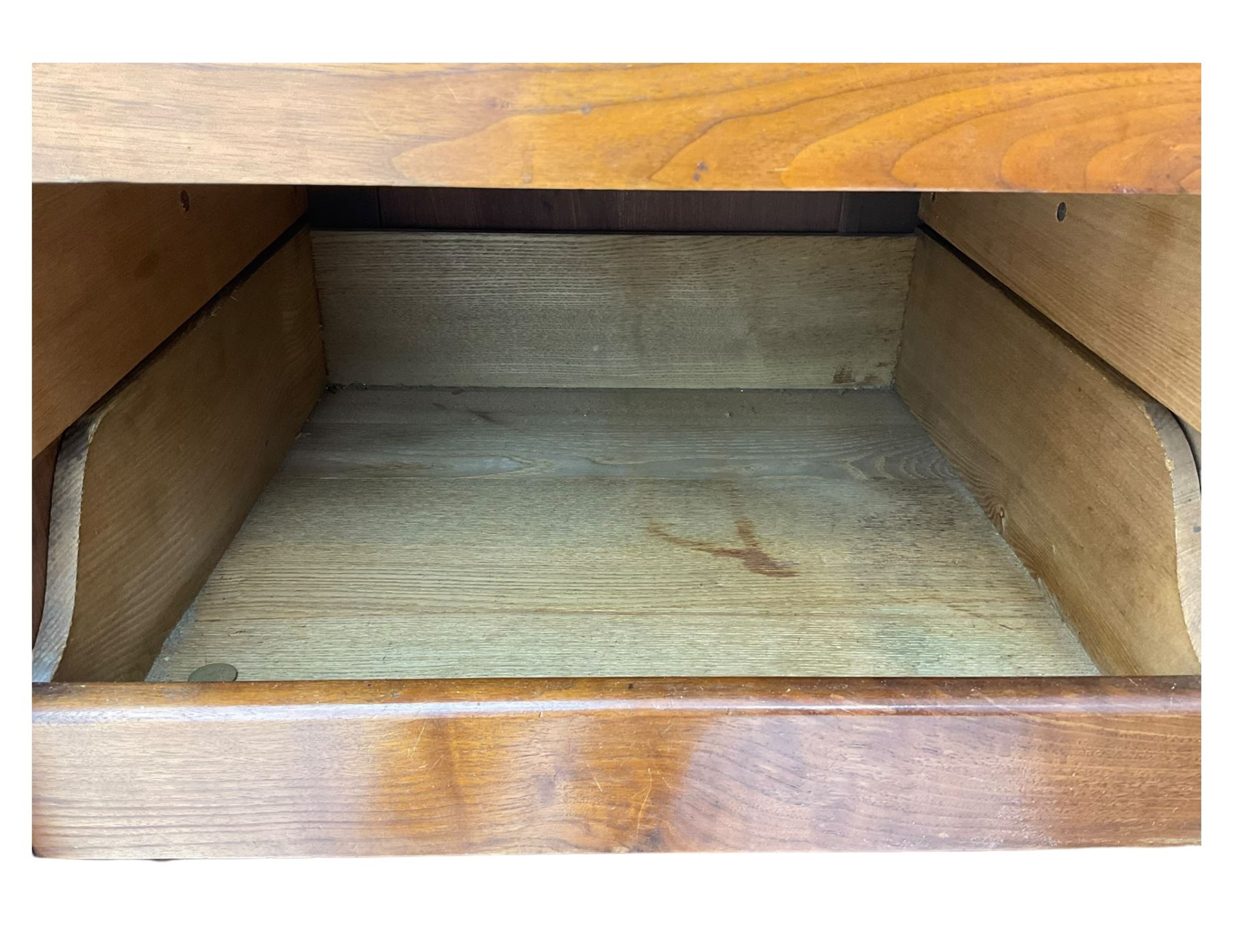 Late Victorian walnut triple combination wardrobe, projecting moulded and dentil cornice, central shaped bevelled mirror glazed door, cartouche and curled leaf carved panels over figured walnut veneered panels, fitted with drawer to base, on bracket feet