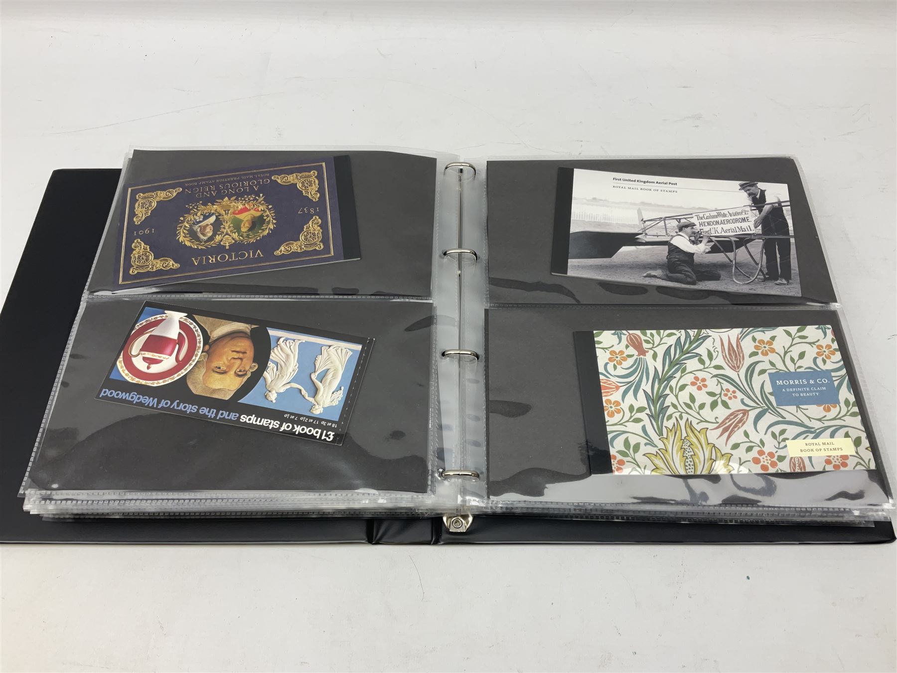 Seventy-five Royal Mail book of stamps, including 'The Story of Beatrix Potter', 'Microcosmos', 'Across The Universe', 'A Perfect Coronation', 'The Bronte Sisters', 'Battle of Trafalgar Death of Nelson' etc, housed in a ring binder album