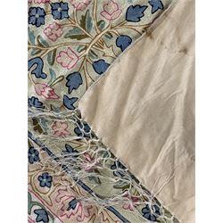 Small pastel prayer rug, cream field with Mihrab arch and trailing floral motifs in pink, blue, and green, bordered by floral patterns, knotted fringe to both ends