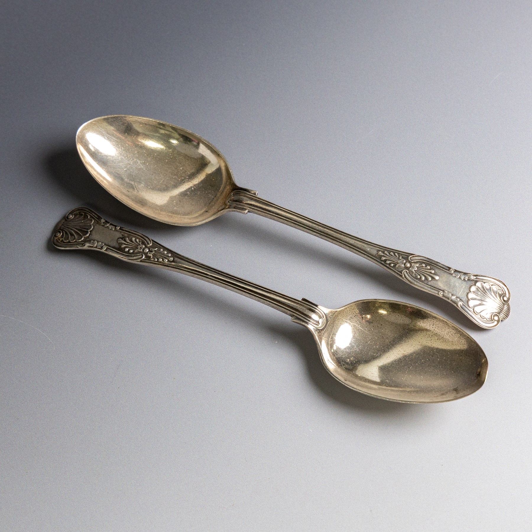 Pair of Edwardian silver King's pattern table spoons, hallmarked Walker & Hall, Sheffield 1902