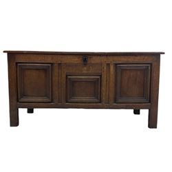 18th century oak coffer or blanket box, moulded rectangular top over panelled front and sides, the triple panel front decorated with applied mouldings, on stile supports