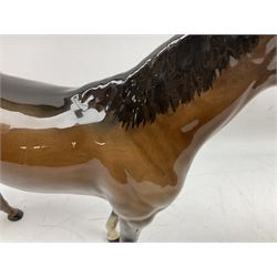 Three Beswick figures, comprising Large Hunter model no.1734,  Small Stallion model no.1992, foal model no.915 and Royal Doulton foal