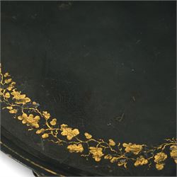 Regency style oval toleware tray table, the black lacquered top with gilt floral decoration, on ebonised faux bamboo frame with stretcher supports