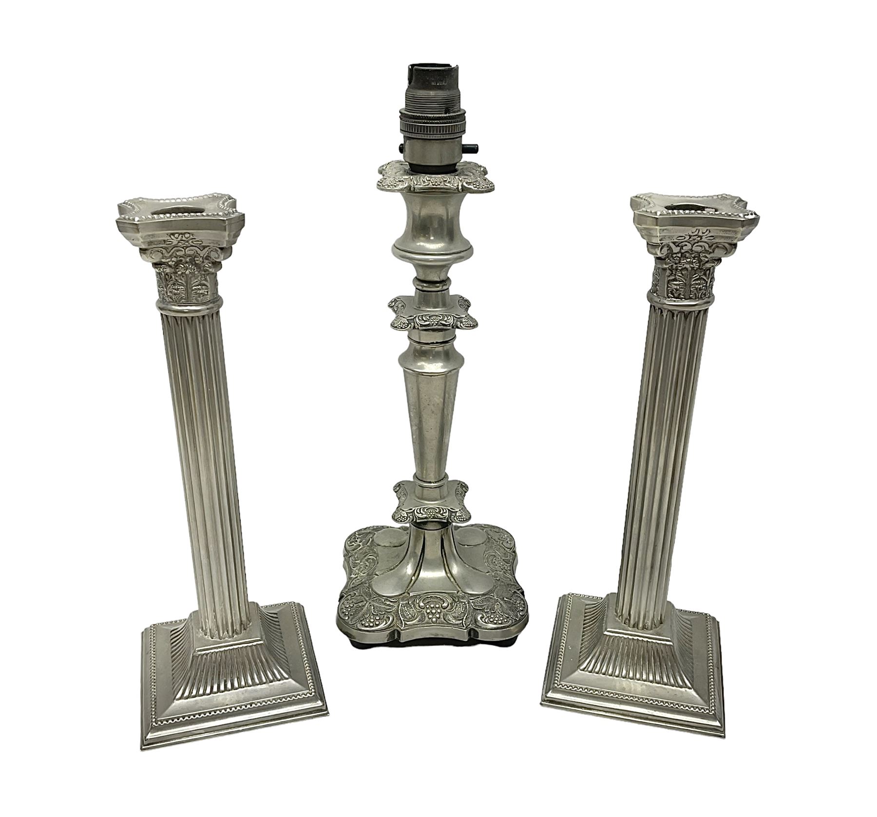 Pair of Corinthian column candlesticks, and a silver plated lamp, candlesticks H26cm