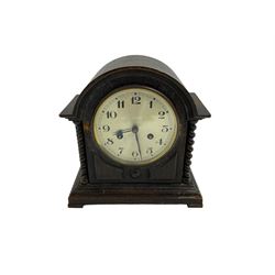 Striking mantle clock in an oak case