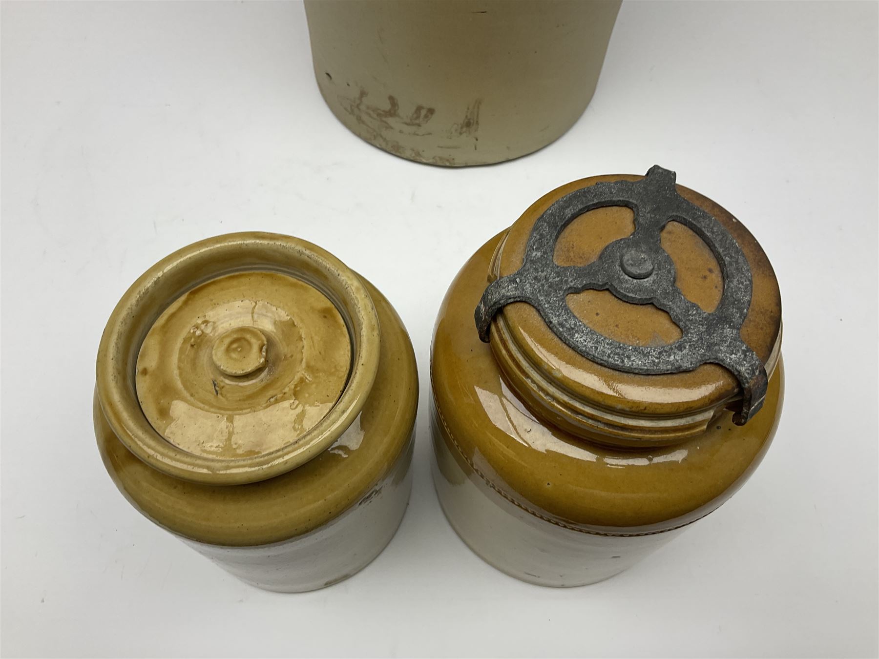 Large 2 gallon stoneware flagon, stamped 'John Soulby Wine Merchant Malton 2 Gall', together with a collection of similar stoneware jars and bottles, largest H40.5cm