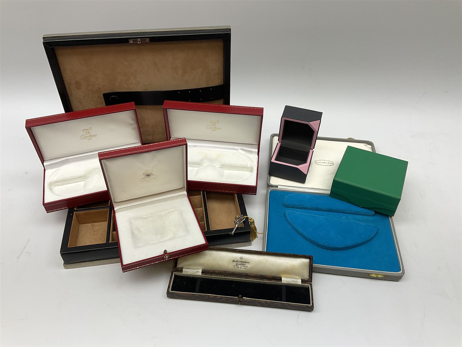 Collection of jewellery boxes including a vintage Boodle & Dunthorne bracelet box, two modern Boodles boxes, two Cartier Santos 701 sunglasses cases, one other Cartier box, Harrods cufflink/ring box and a Penlington & Batty necklace box (8)