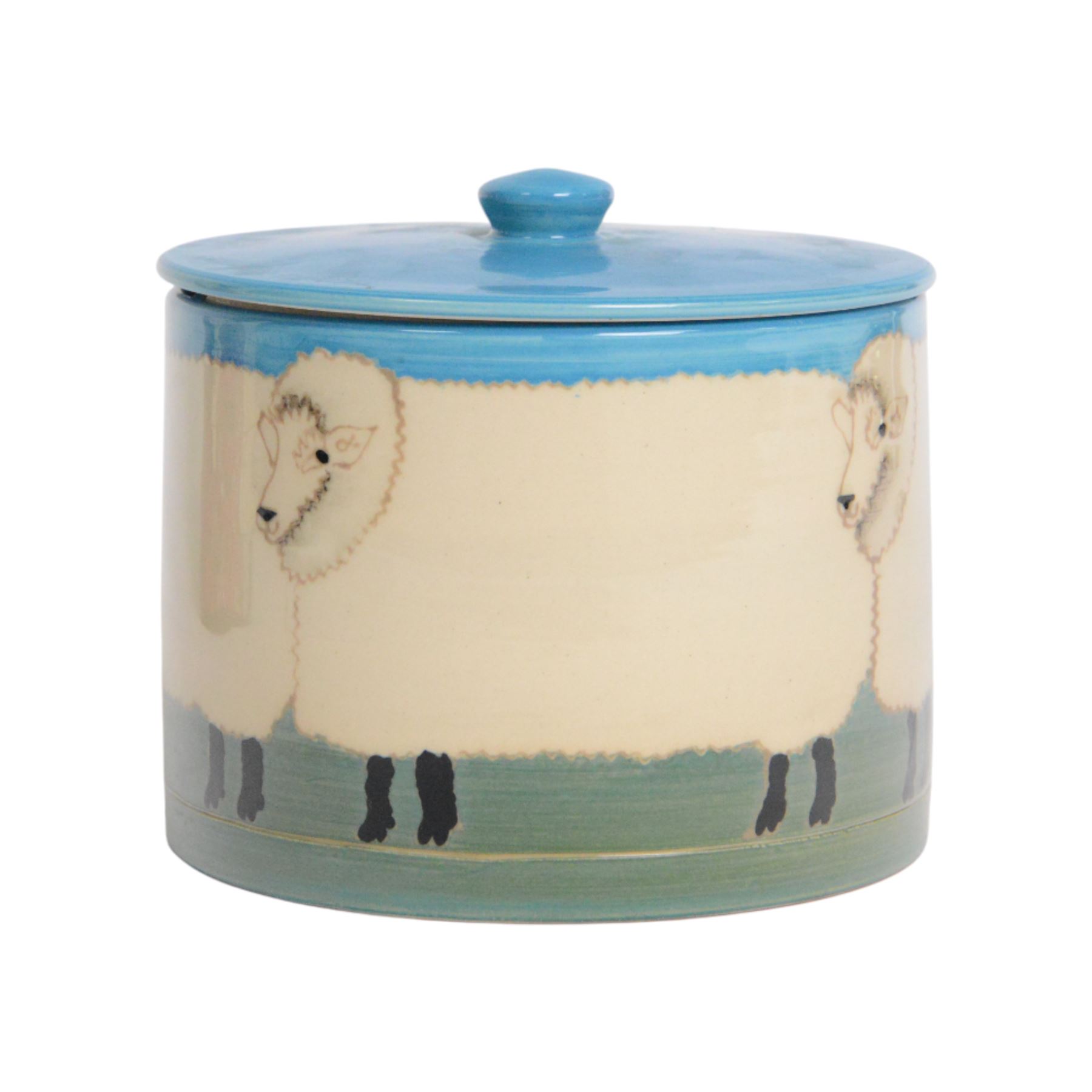 Dennis Chinaworks jar and cover, the body decorated with sheep, with a blue lid, impressed and painted marks beneath, H10cm