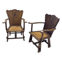 Pair of Arts and Crafts oak armchairs each with shaped backrest centred by polychrome painted crest, rush seat over straight square legs united by shaped central stretcher