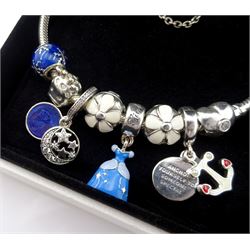 Pandora Moments flower clasp silver bracelet with Disney Cinderella charm, seven other Pandora charms, and flower safety chain, boxed