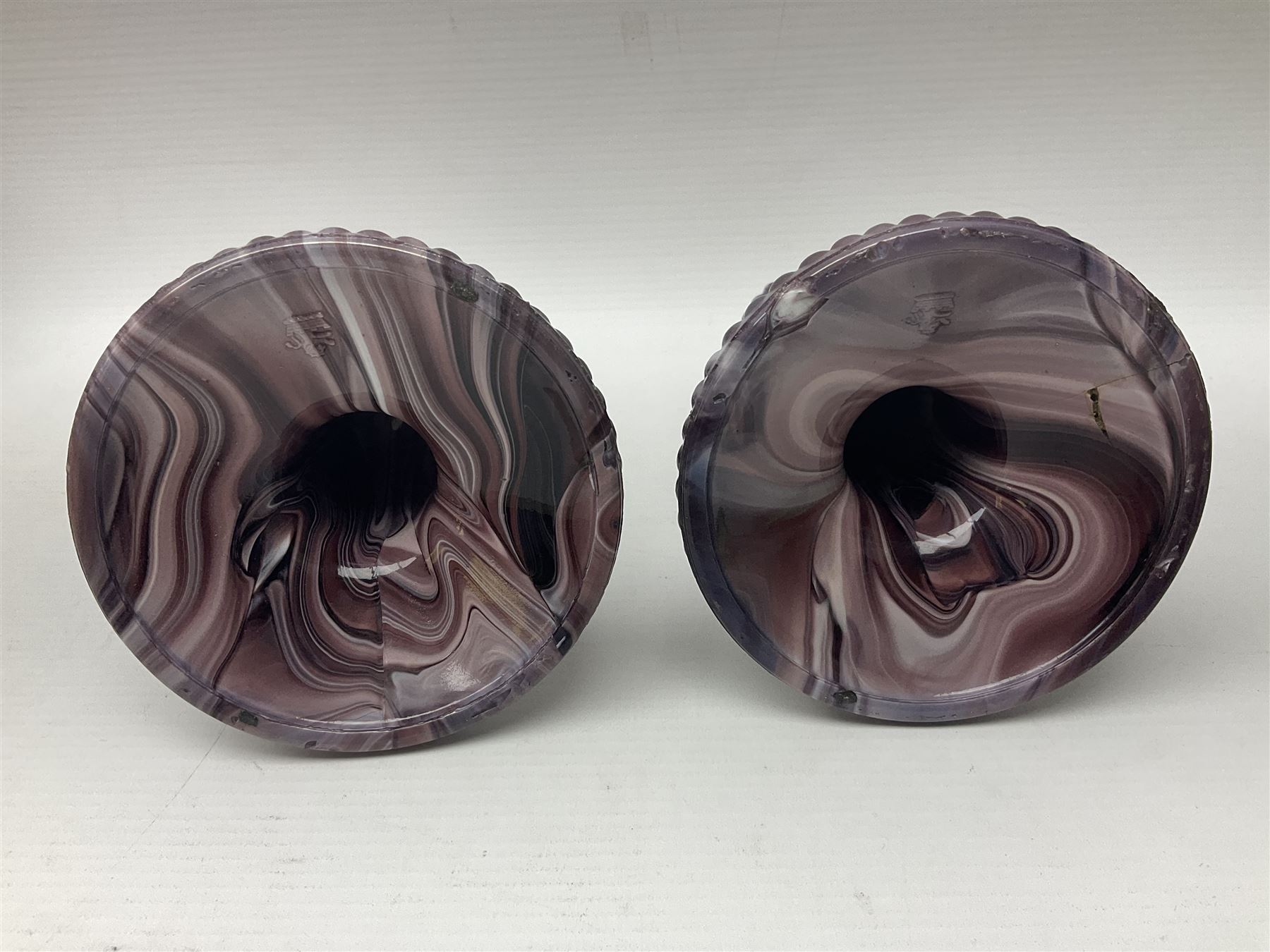 Daum glass two stemmed candle stick signed to verso, together with a pair of slag glass purple candle sticks, Daum H21cm